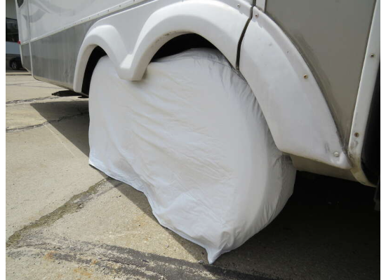 White ADCO Tyre Gard on Single RV Tire with UV Protection - Angle View | United RV Parts