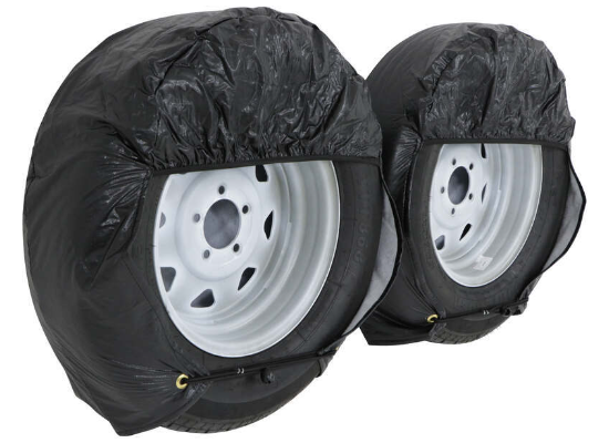 Black ADCO Ultra Tyre Gard Wheel Covers Installed on Two RV Tires - Side Angle | United RV Parts