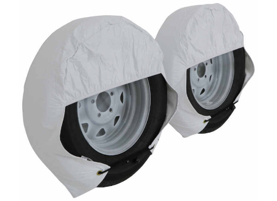 White ADCO Ultra Tyre Gard RV Tire Covers Installed on Trailer Wheels - Lifestyle View | United RV Parts