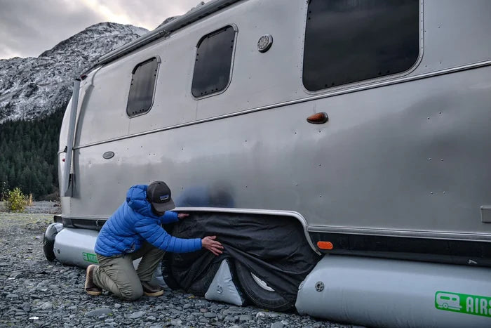 Installing AIRSKIRTS Black Dual-Axle Trailer Tire Cover on Airstream - Close-Up Install | United RV Parts
