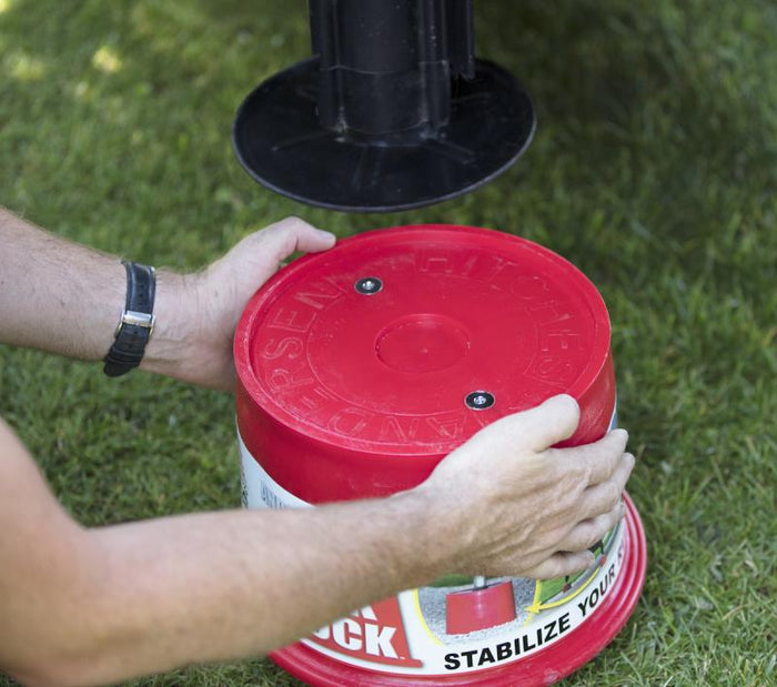 Hands Demonstrating Andersen Jack Block Size - Stabilize Your Trailer | United RV Parts