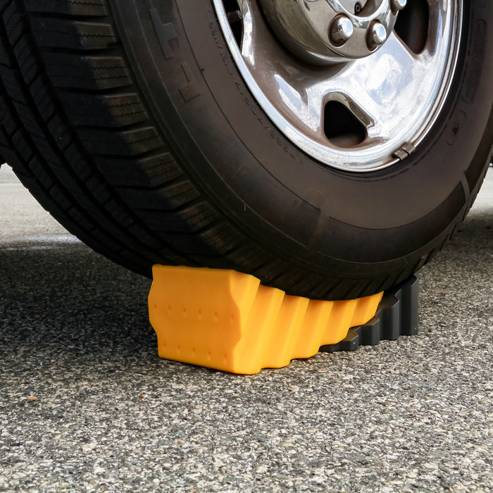 Orange Curved Leveler Under RV Wheel - Ground Detail | United RV Parts