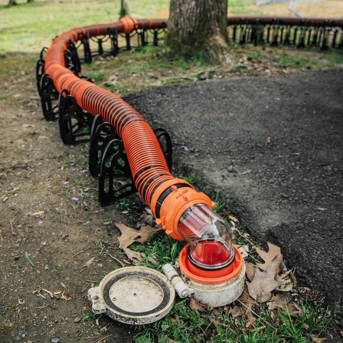 Orange RhinoEXTREME Sewer Hose at RV Dump Station - In-Use Setup | United RV Parts