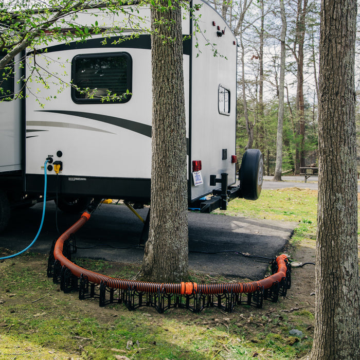 RhinoEXTREME Sewer Hose Supporting RV at Campground - Lifestyle Application | United RV Parts