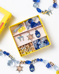 It's time to celebrate with the Make It Hanukkah Mini Bead Kit! It's the perfect way to show your holiday spirit this season – with beads and charms overflowing with extra special meanings. Charms included symbolize life and the good things to come, and for hope, peace and protection.  Small parts, not intended for children under 3 years.