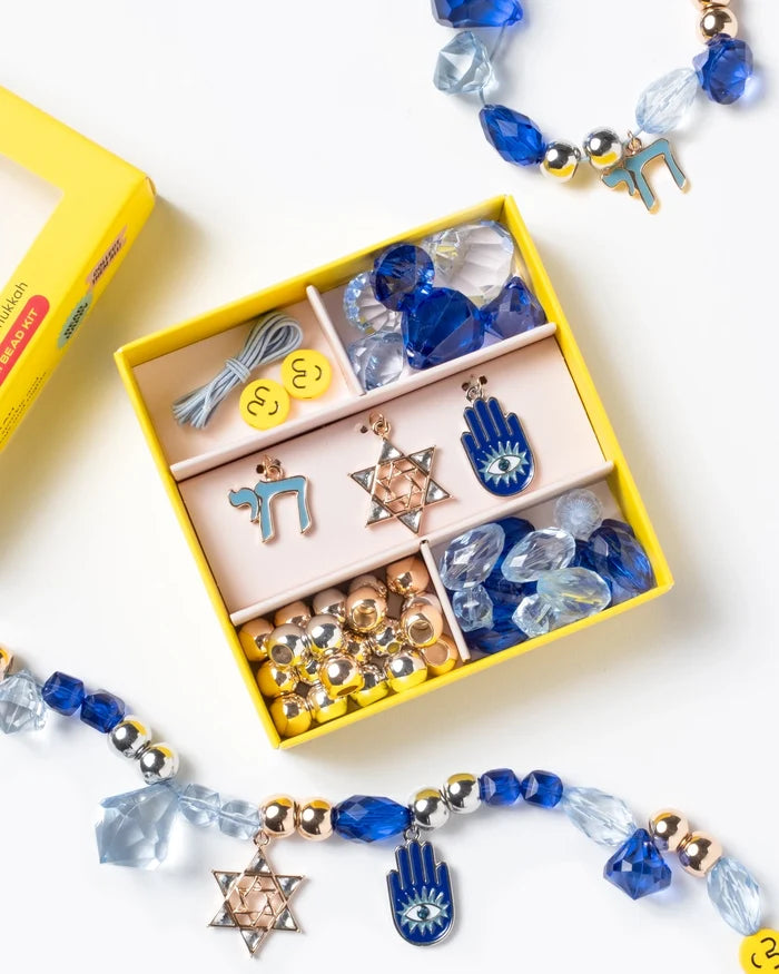 It's time to celebrate with the Make It Hanukkah Mini Bead Kit! It's the perfect way to show your holiday spirit this season – with beads and charms overflowing with extra special meanings. Charms included symbolize life and the good things to come, and for hope, peace and protection.  Small parts, not intended for children under 3 years.