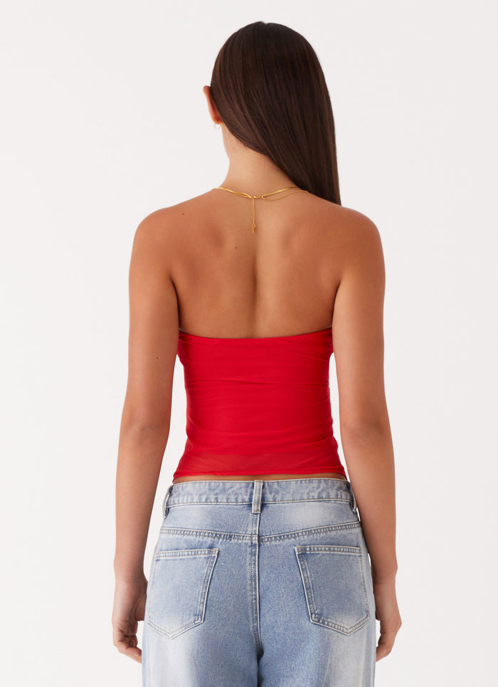 Womens Sunlight Cascade Top in the colour Red in front of a light grey background