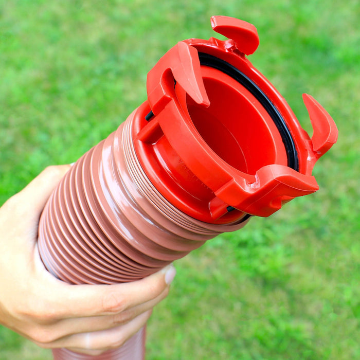 Hand Holding Red Valterra EZ Coupler RV Sewer Hose Adapter - Bayonet Lock Detail Close-Up | United RV Parts